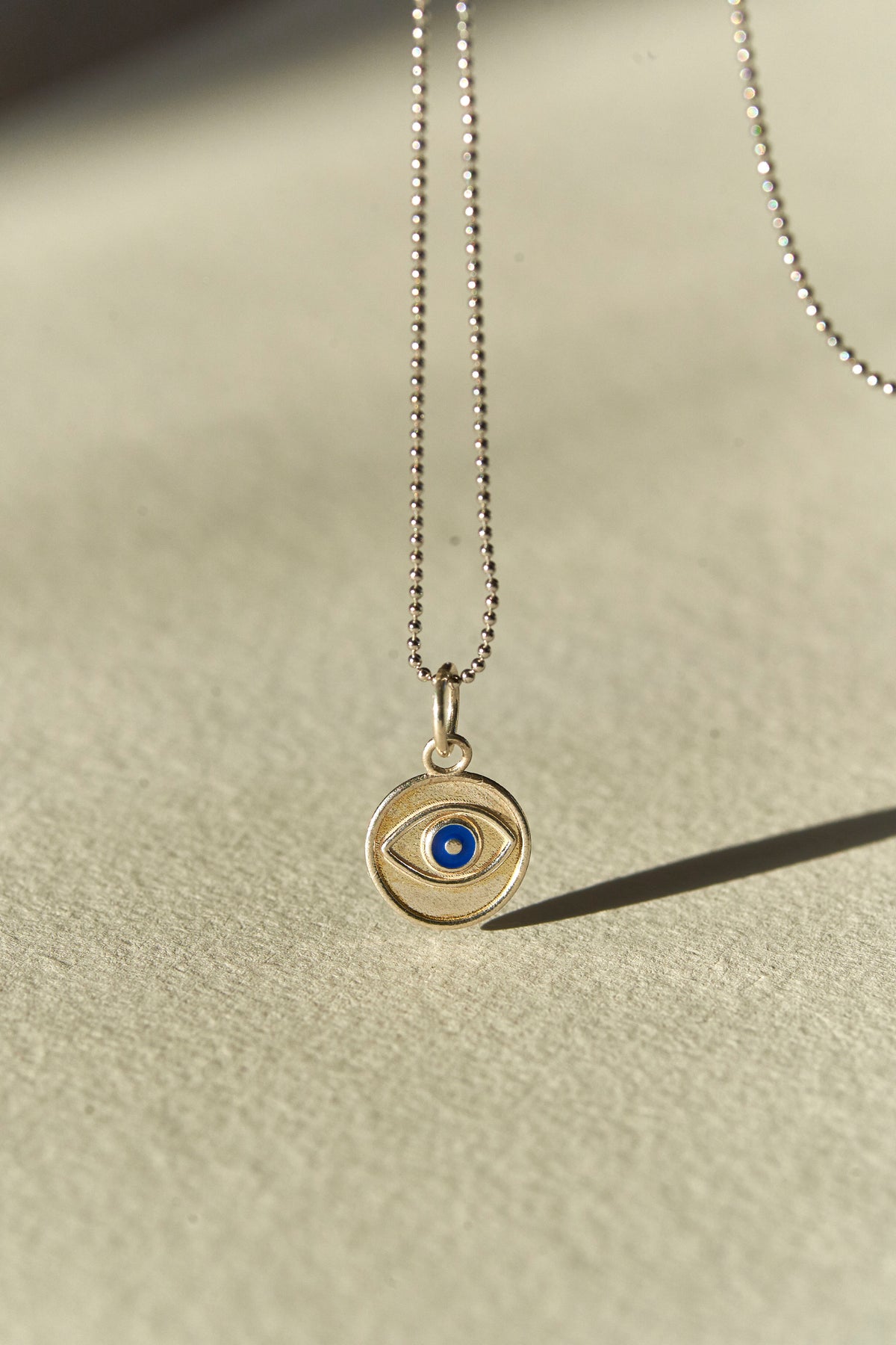 Evil Eye Coin Pendant